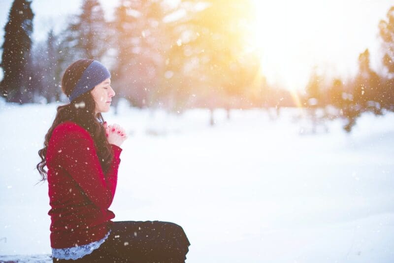 meditating woman in snow