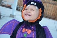 Little girl in a bat Halloween costume