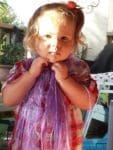 Cute little girl playing dress up