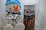 Stuffed snowman and wafer tin