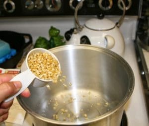 woman making popcorn balls