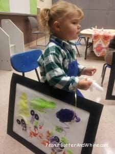 Cute girl in painting class