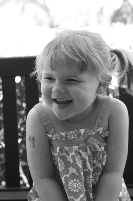 laughing little girl in black and white