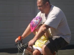 Tyke Toter Front Mount Childs Bike Seat Dad and Daughter on bike