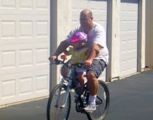 Tyke Toter Front Mount Childs Bike Seat Dad and Daughter on bike