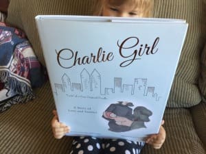 Little girl with Charlie Girl Book