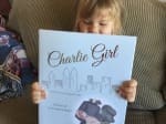 Little girl with Charlie Girl Book