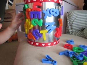 Little girl with her EduKid Toys Magnetic Letters & Numbers