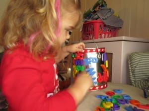 Little girl with her EduKid Toys Magnetic Letters & Numbers