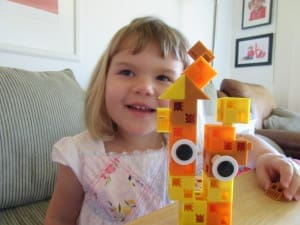 Little girl playing Click-A-Brick Set