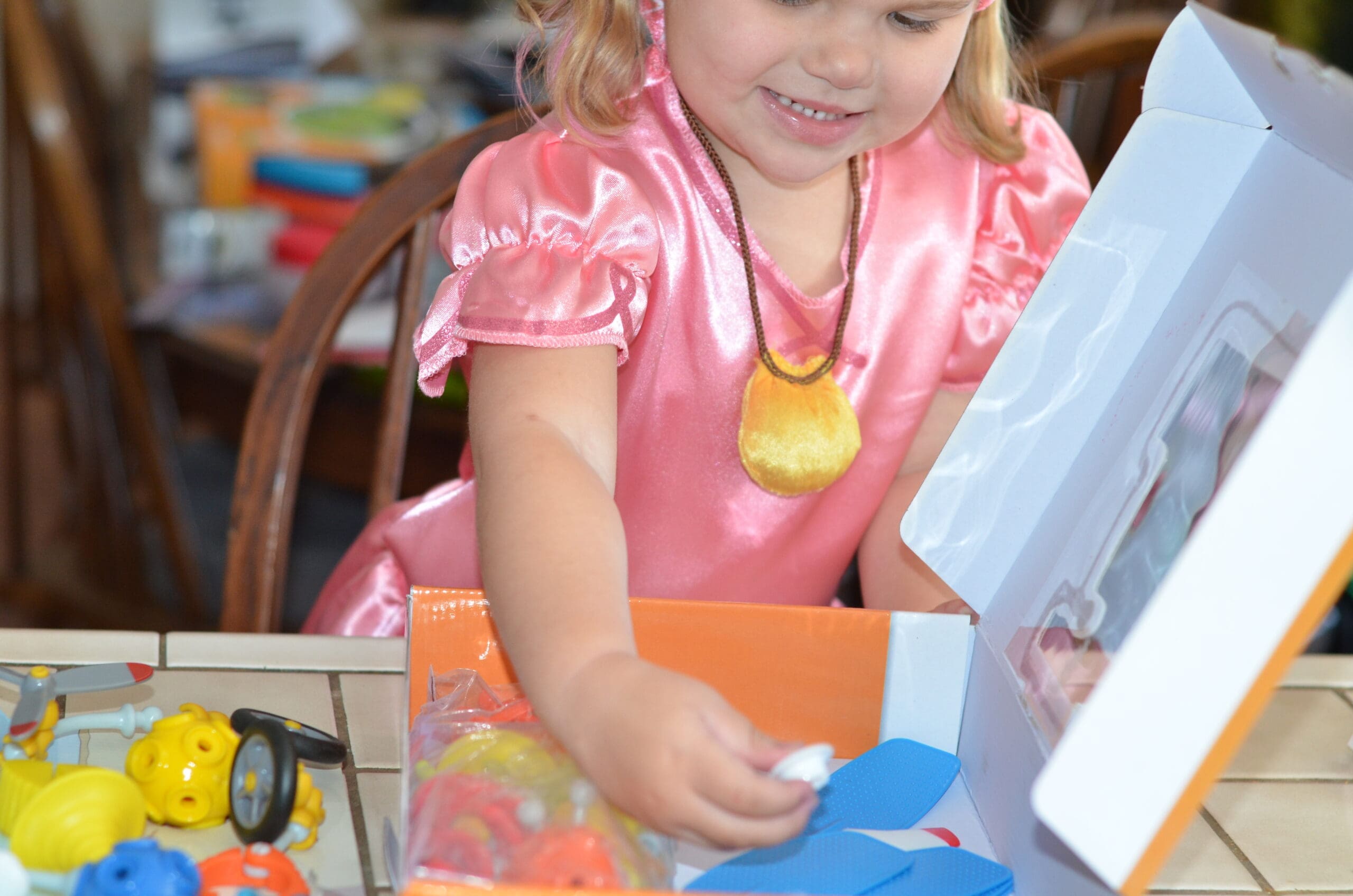 Little girl building a OgoBild toy
