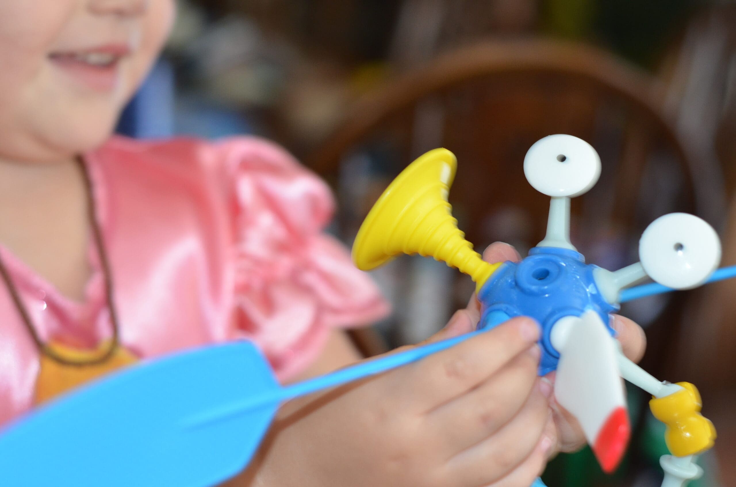 Little girl building a OgoBild toy