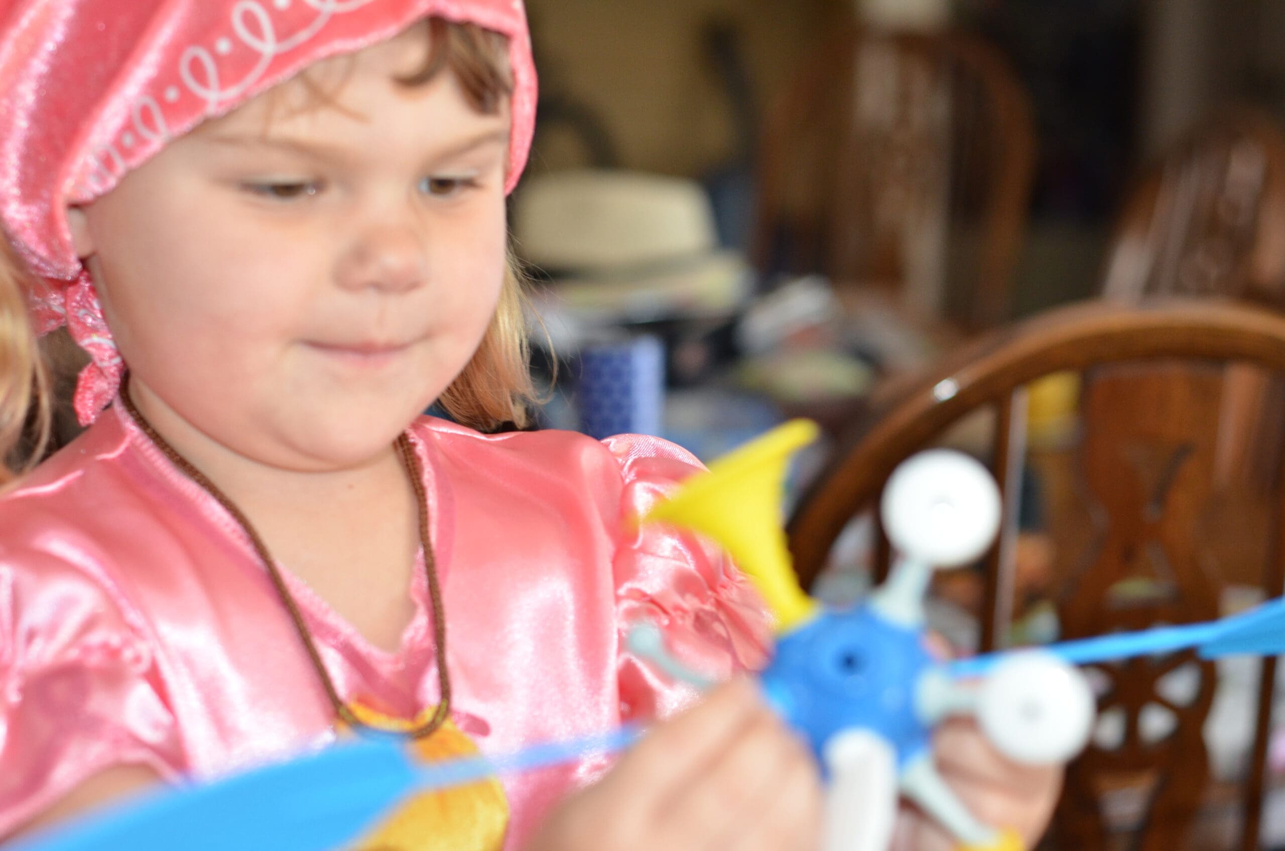 Little girl building a OgoBild toy