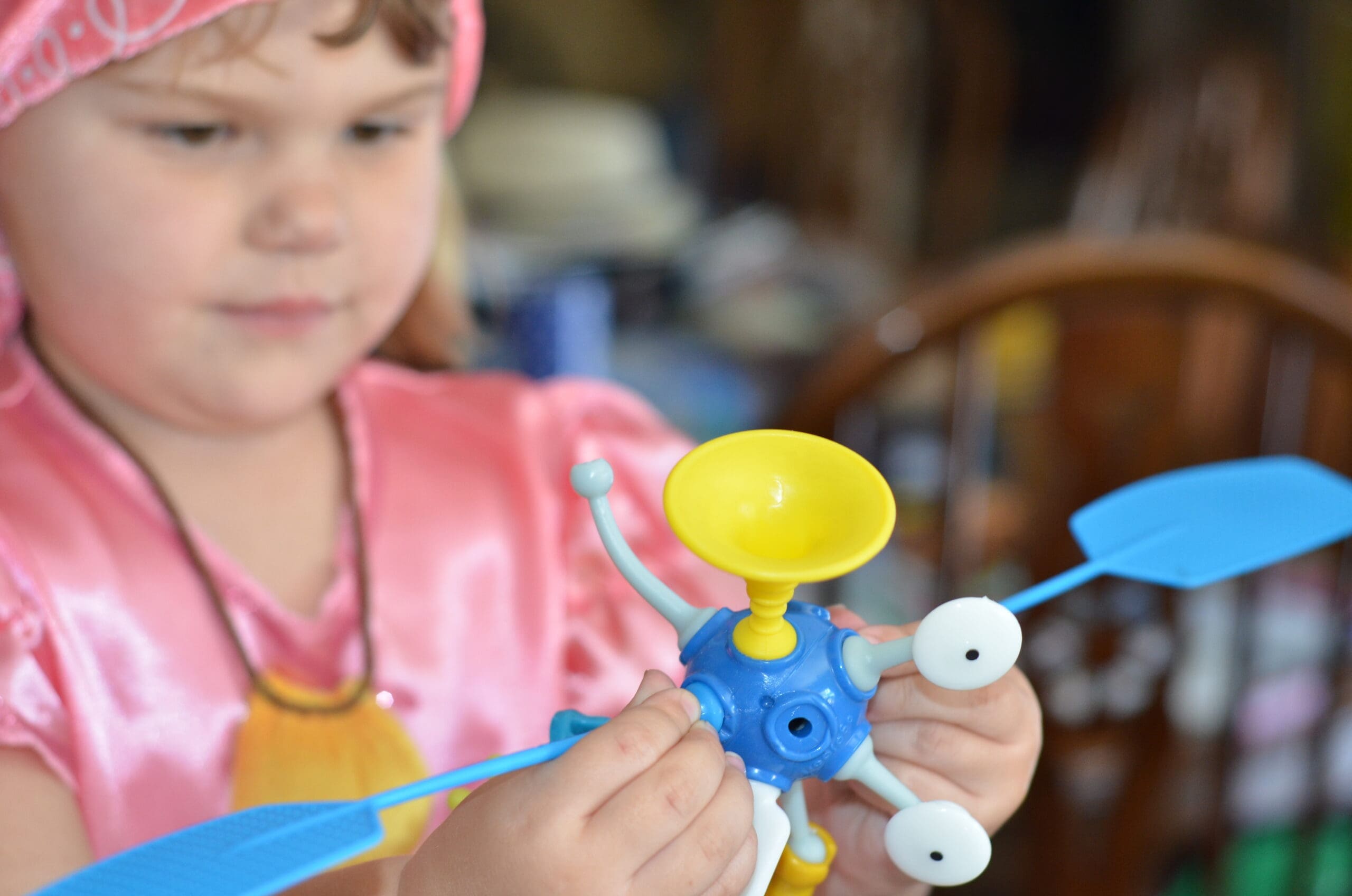Little girl building a OgoBild toy