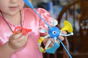 Little girl building a OgoBild toy