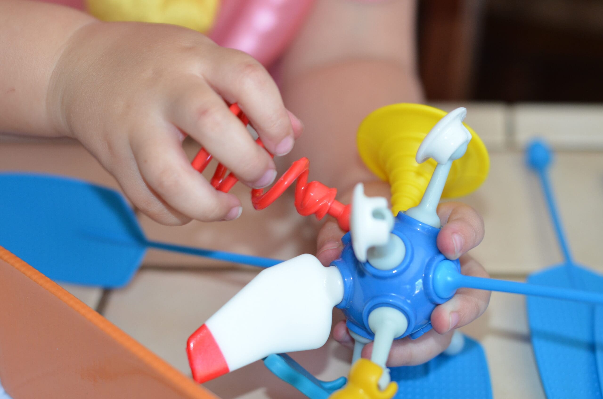 Little girl building a OgoBild toy