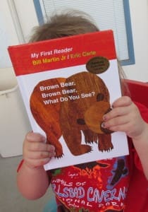 Little girl holding a book