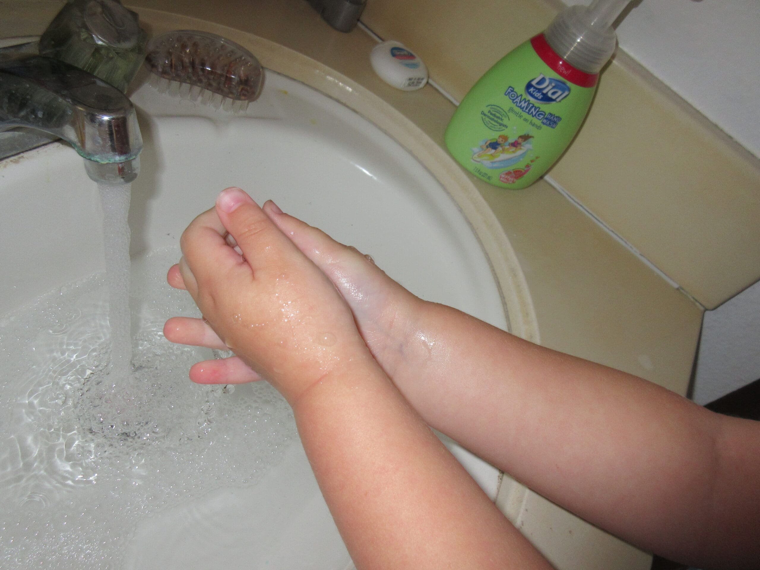 Little girl washing hands