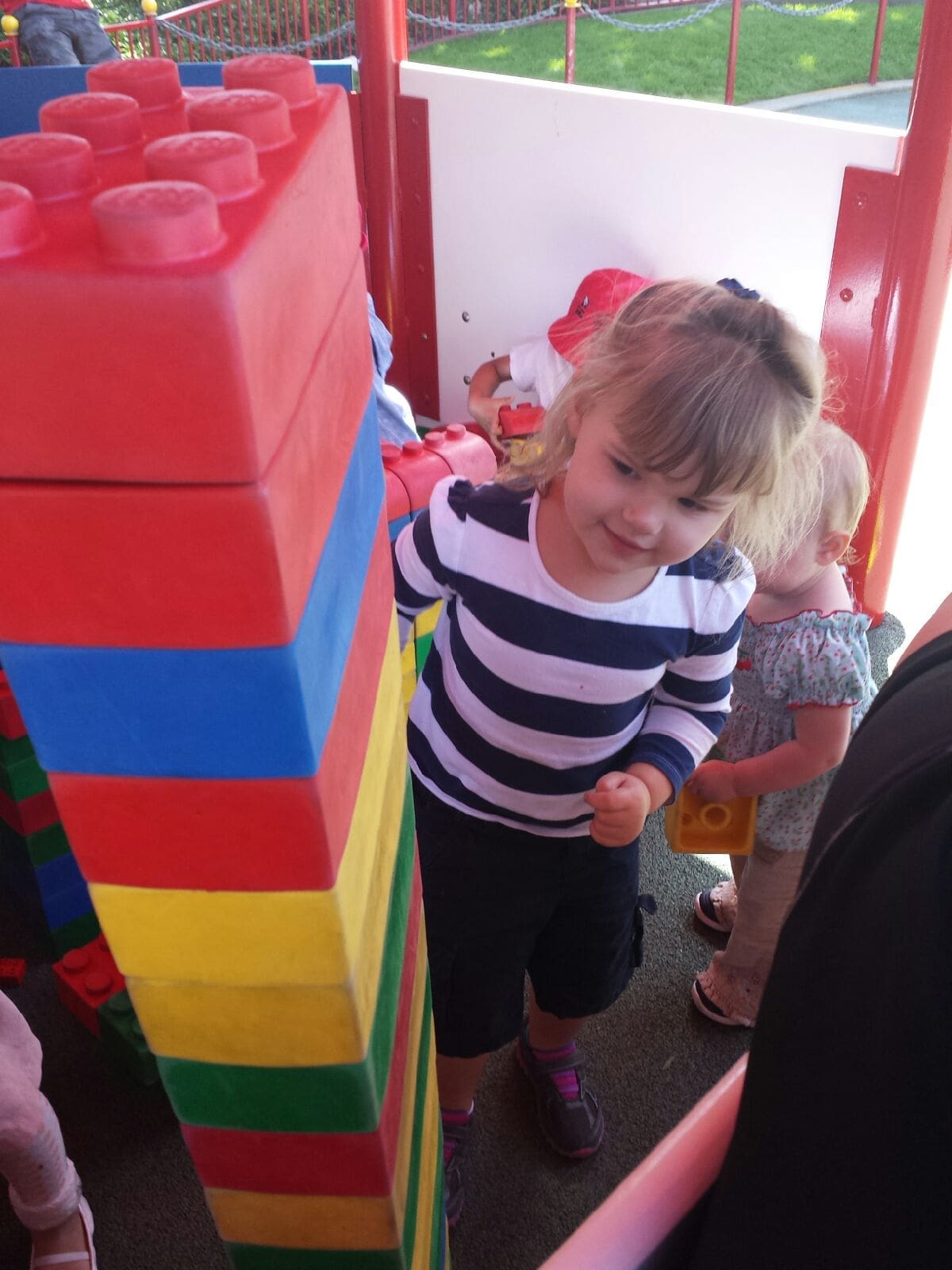 Little girl building giant legos Legoland California
