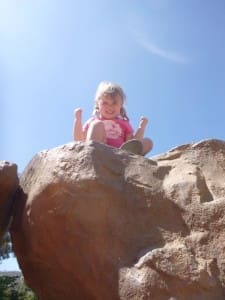 Little girl on a rock