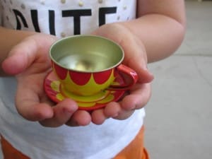 Little girl having a tea party