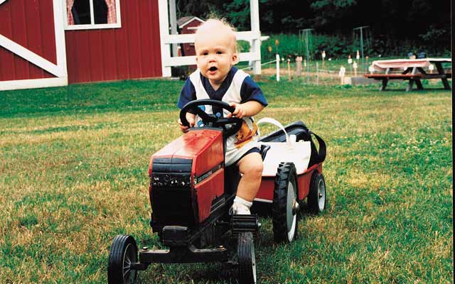 little boy on tractor
