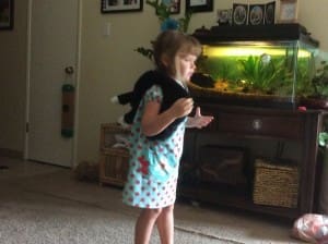 little girl with Scruffy Cat heating pad for kids