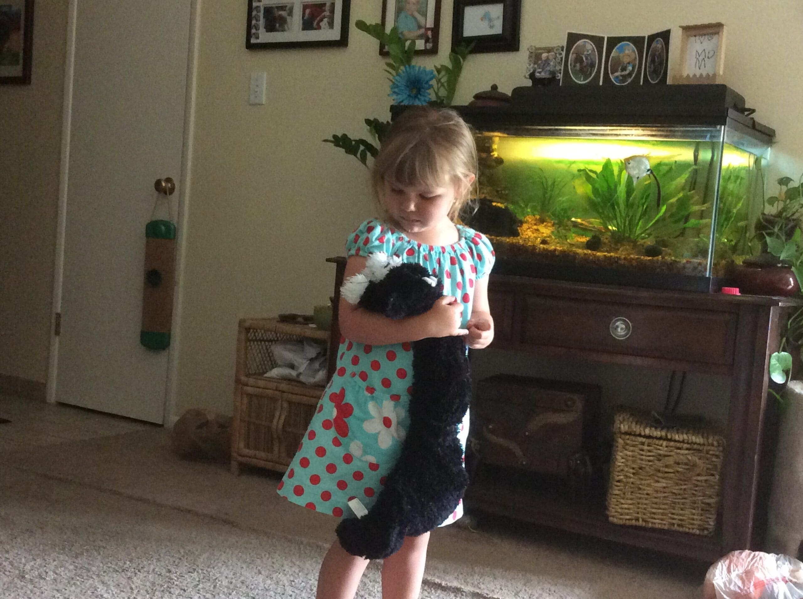 little girl with Scruffy Cat heating pad for kids