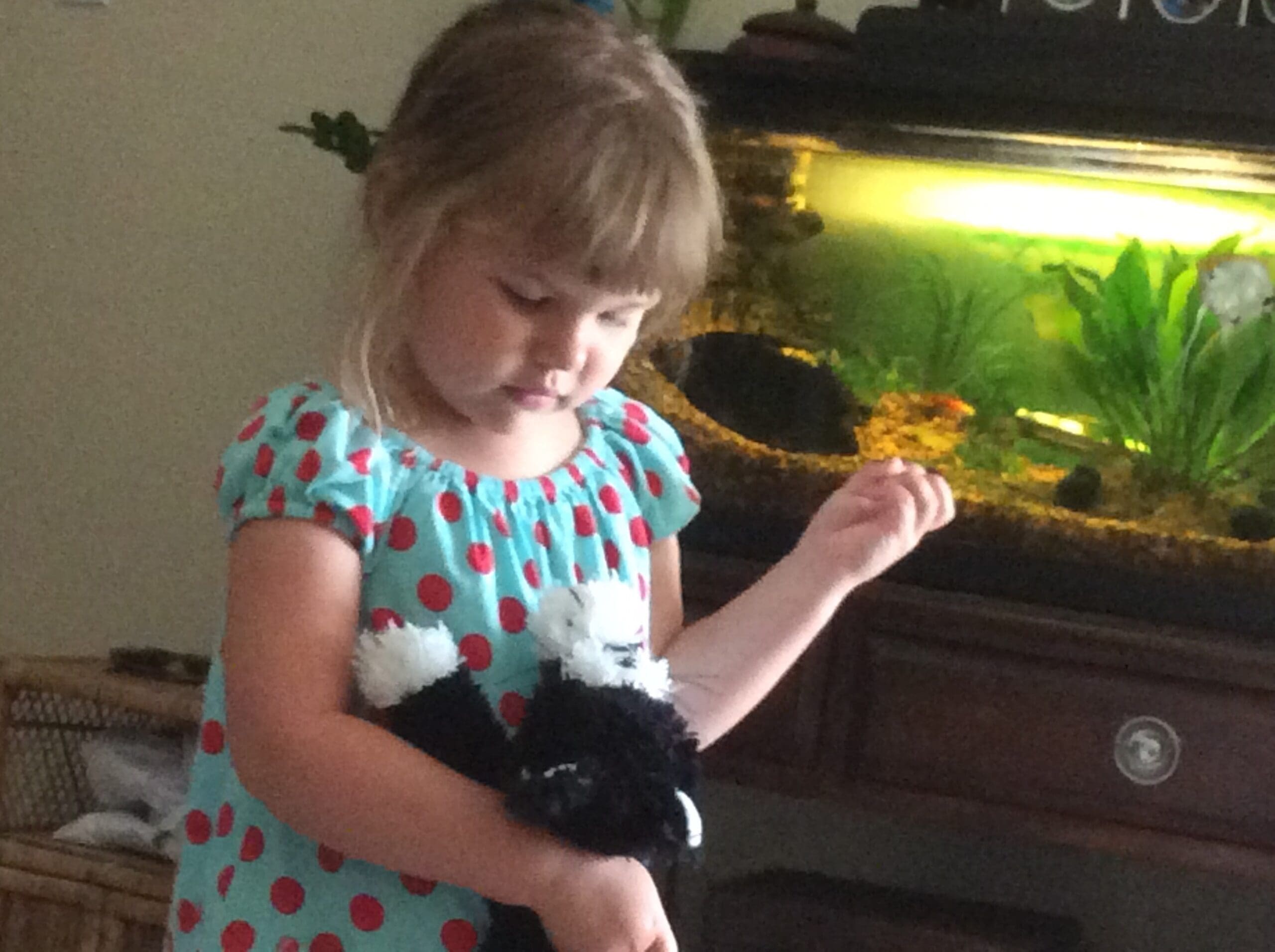 Little girl with Scruffy Cat heating pad for kids