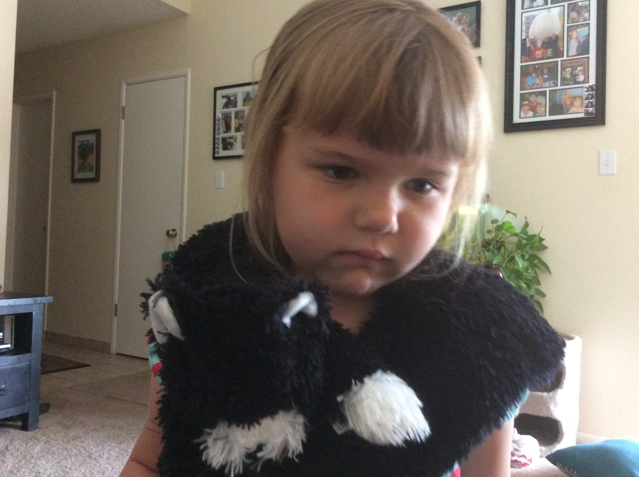 little girl with Scruffy Cat heating pad for kids