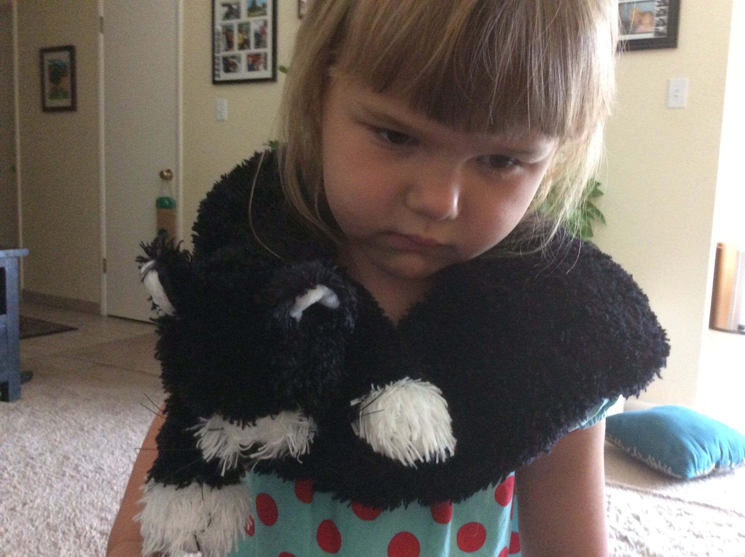 little girl with Scruffy Cat heating pad for kids