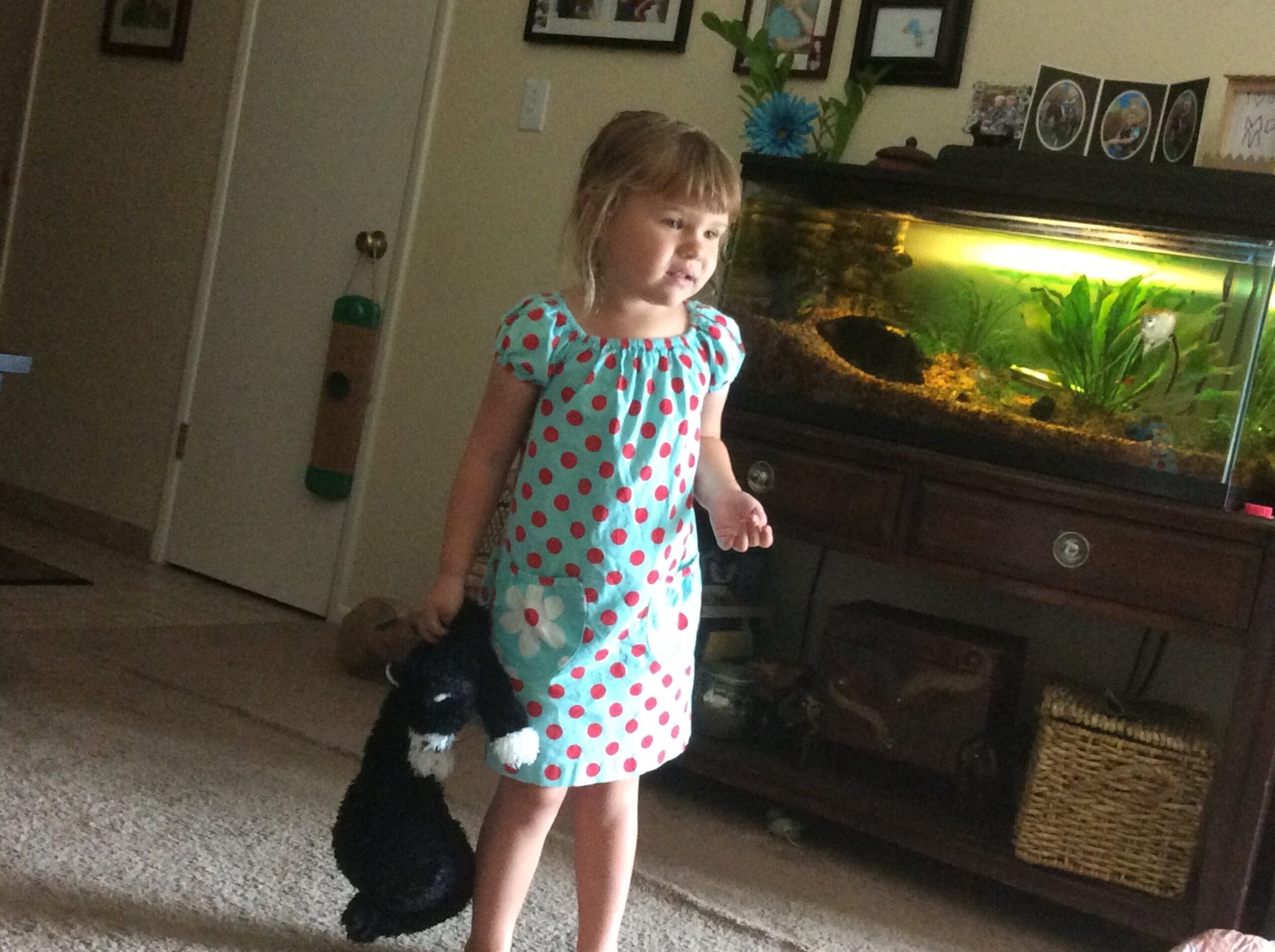 little girl with Scruffy Cat heating pad for kids