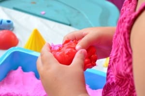 Little girl playing with Sands Alive