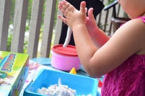 Little girl playing with Sands Alive