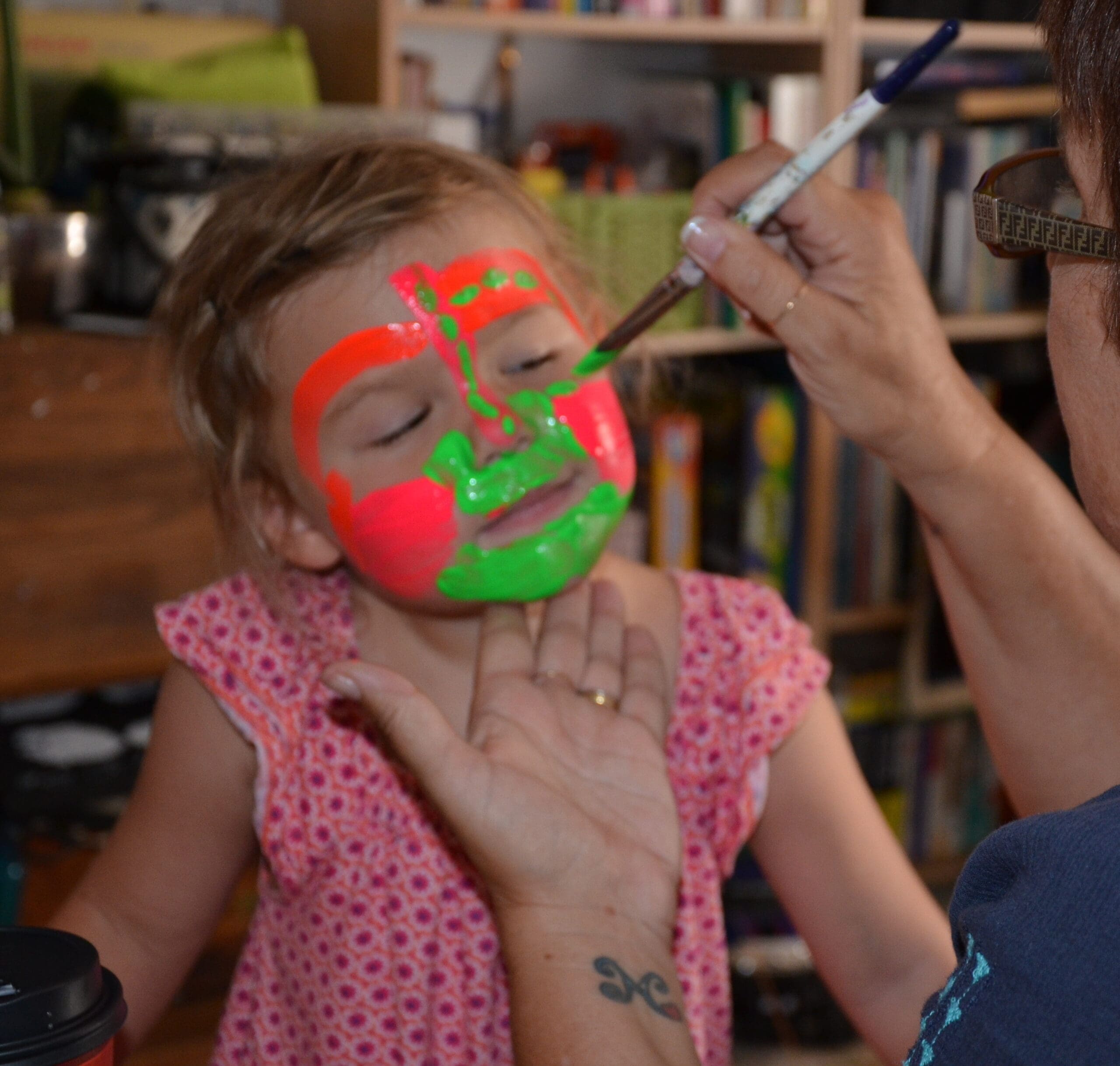 Little girl in neon face paint