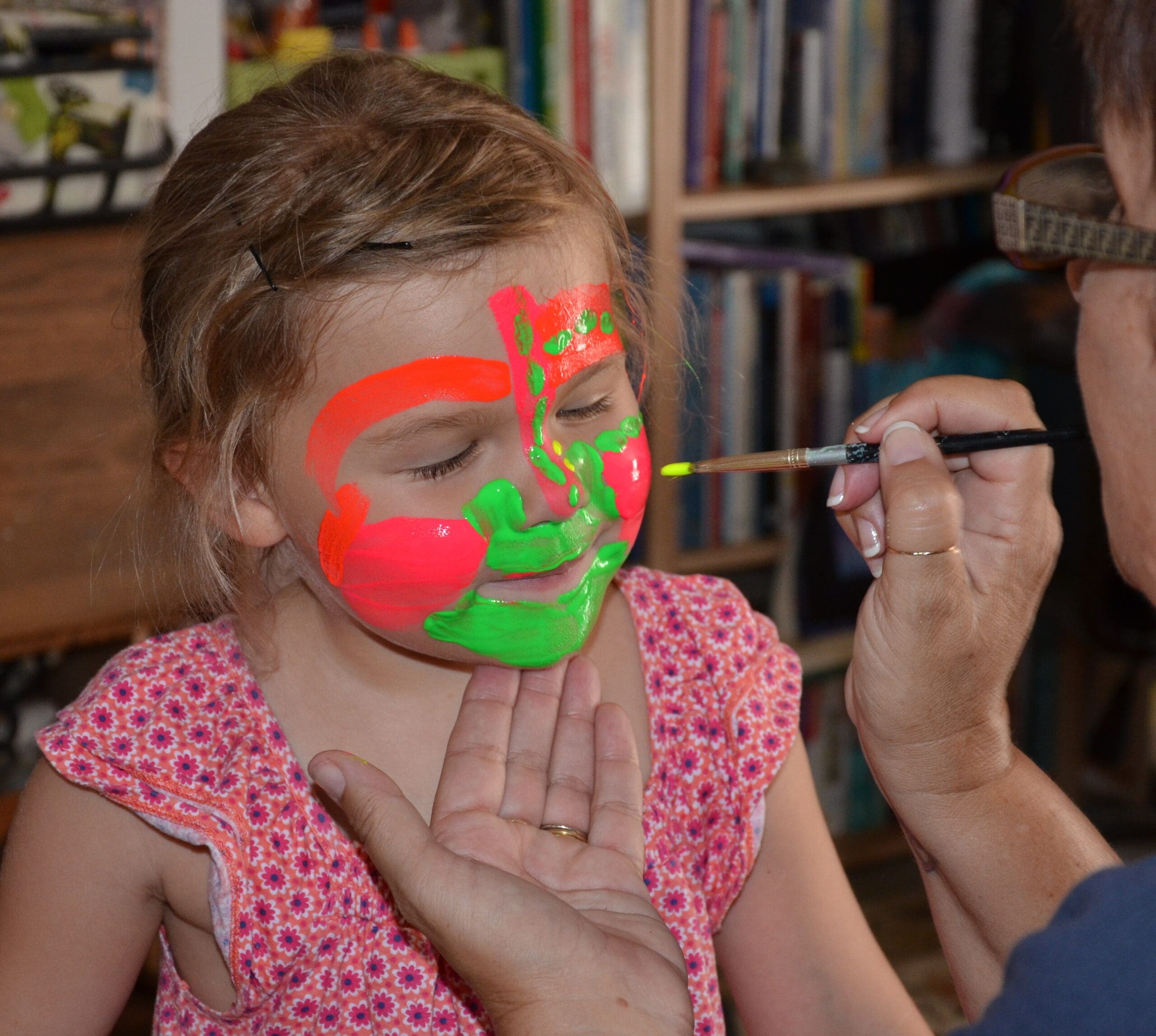 Little girl in neon face paint