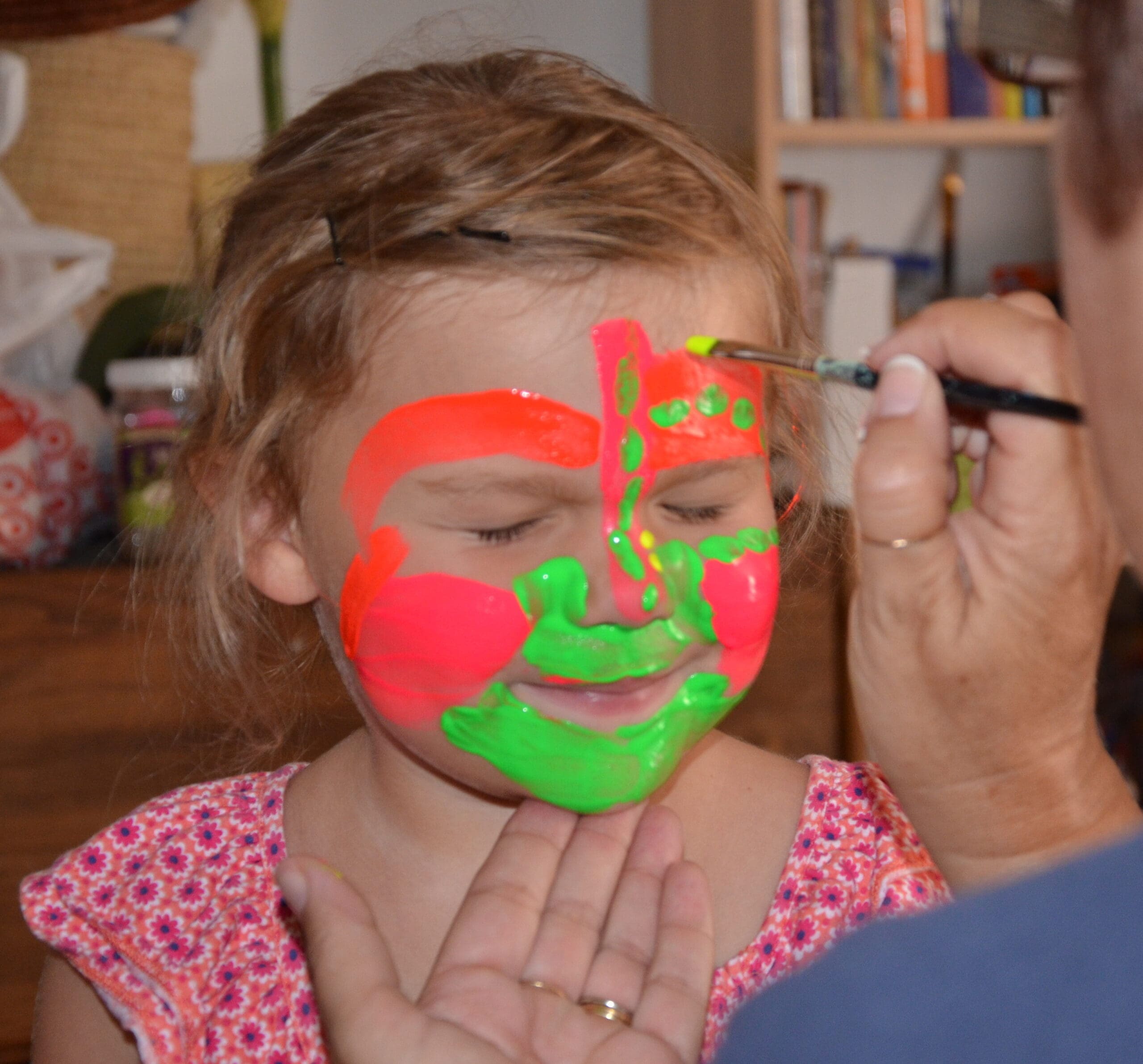 Little girl in neon face paint