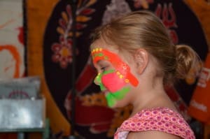 Little girl in neon face paint