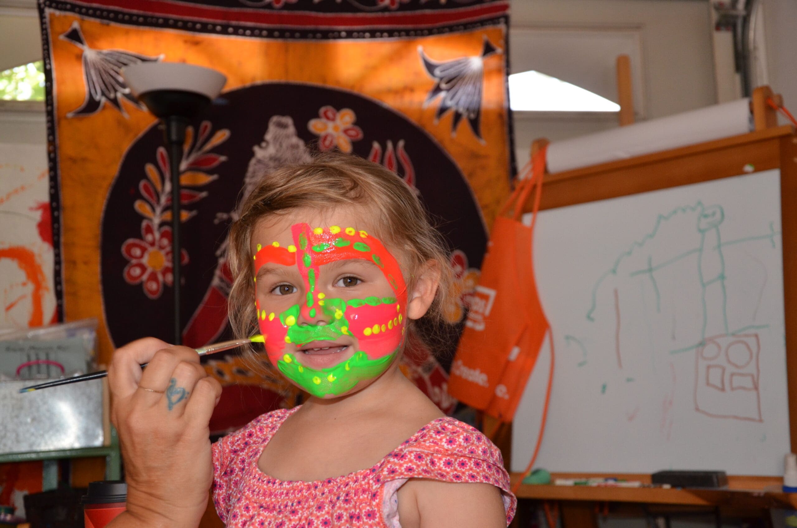 Little girl in neon face paint