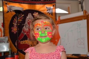 Little girl in neon face paint