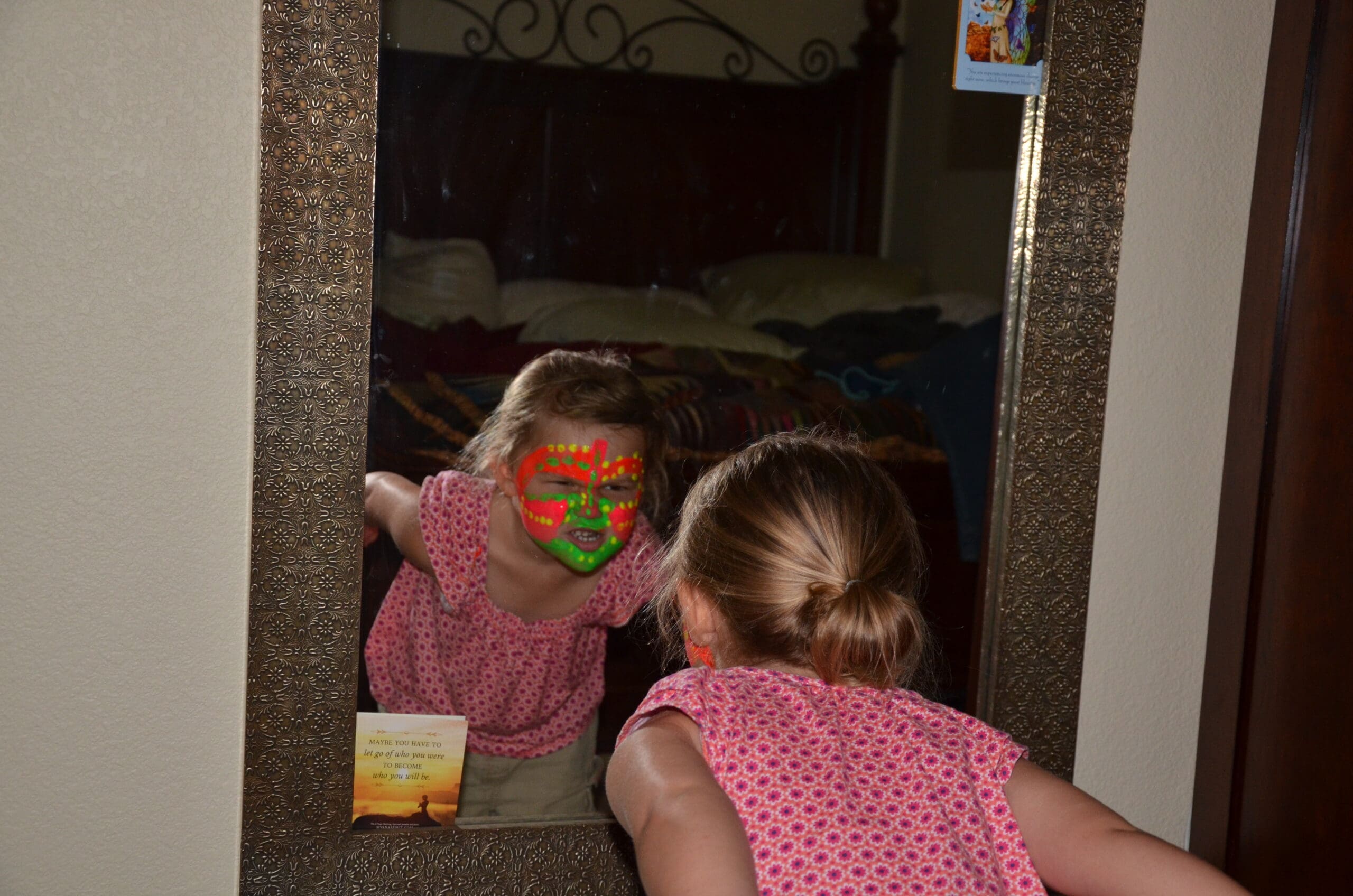 Little girl in neon face paint