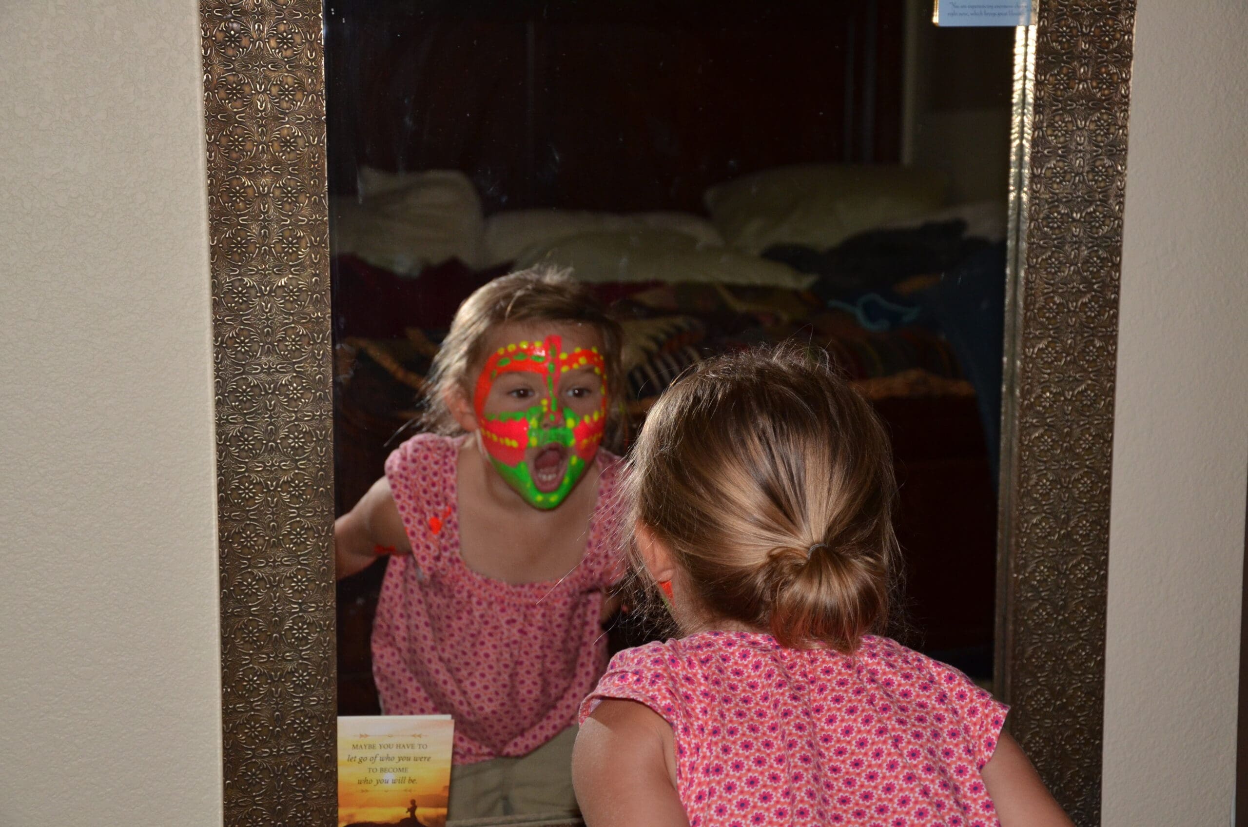 Little girl in neon face paint