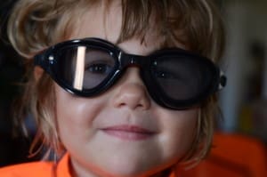 little girl in swim goggles