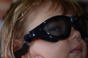 little girl in swim goggles