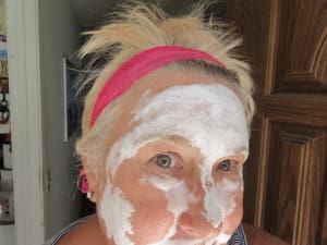 Woman using Exuviance facial products