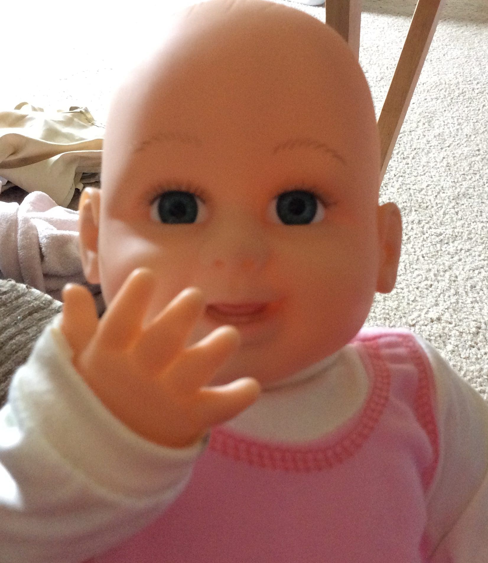 Little girl playing with her doll