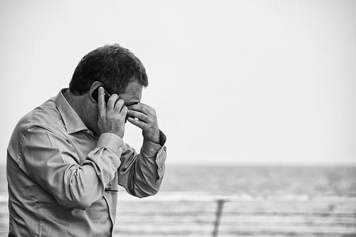 Man at the beach on phone
