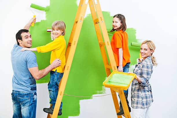 Family painting a wall