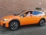 The Head Peanut (Connie Gruning) PR Picture of me in a orange subaru.