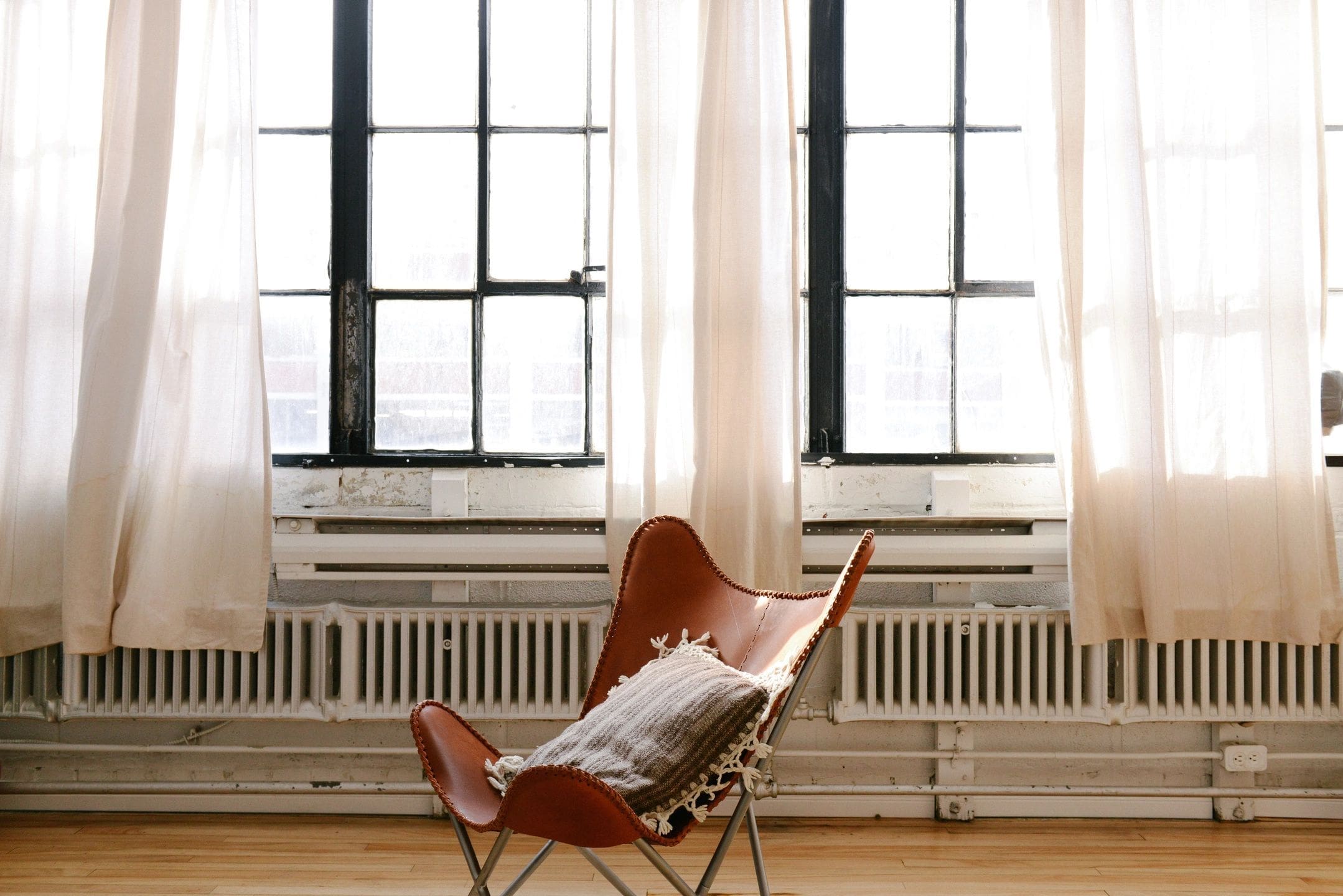 Chair in front of open windows